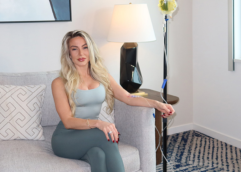 Woman receiving IV therapy for hydration