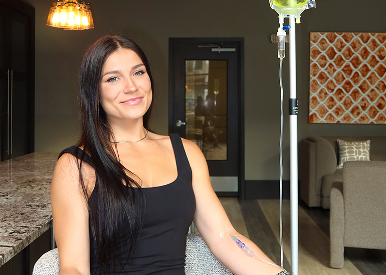 Woman receiving IV therapy for beauty and wellness