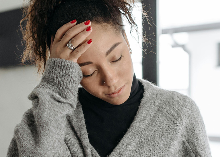 Woman experiencing migraine discomfort